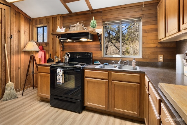 kitchen with fume extractor, wooden walls, black electric range, and light wood-type flooring