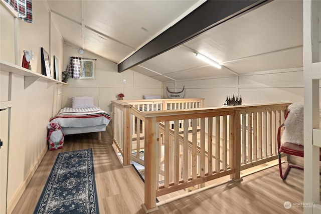 interior space with light wood-type flooring and lofted ceiling