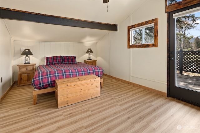 bedroom with light hardwood / wood-style floors, ceiling fan, vaulted ceiling with beams, and access to outside