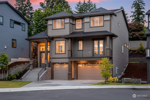 view of front of house with a balcony and a garage