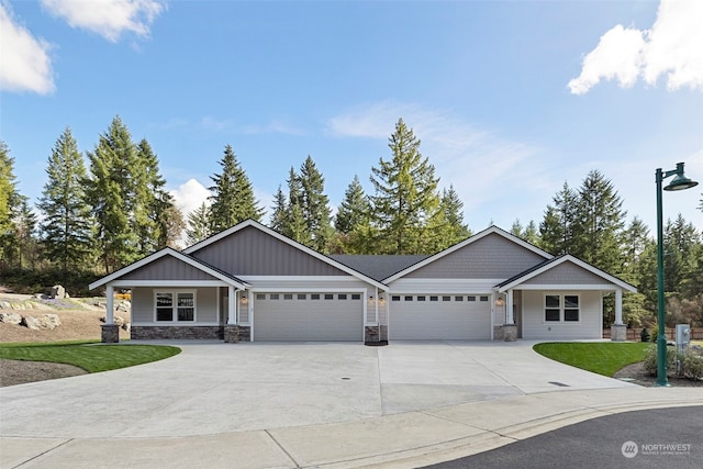 view of front of property featuring a front yard and a garage