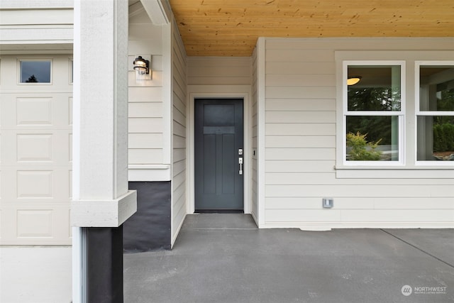 doorway to property featuring a garage