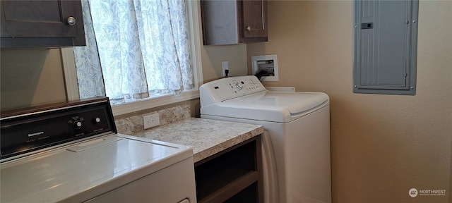 washroom featuring washing machine and clothes dryer, cabinets, and hookup for a washing machine