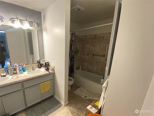 full bathroom with dual vanity, shower / bath combination with curtain, tile floors, and toilet