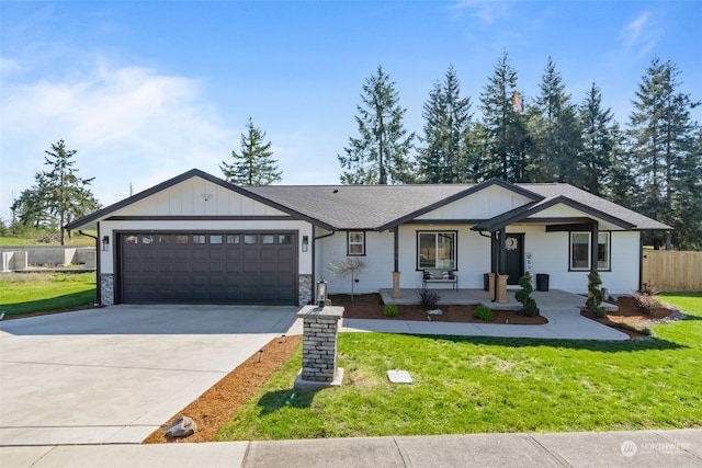 view of front of house with a front yard and a garage