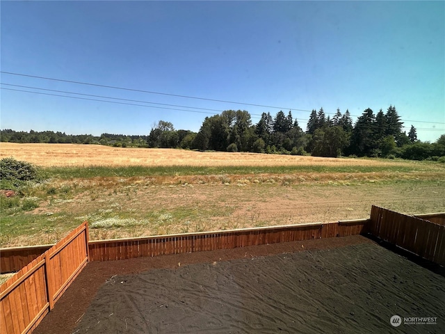 view of yard with a rural view