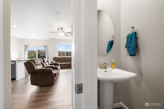 bathroom with ceiling fan and wood-type flooring