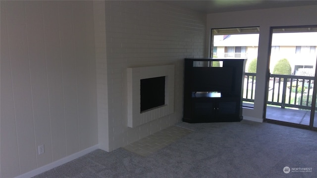 unfurnished living room with carpet