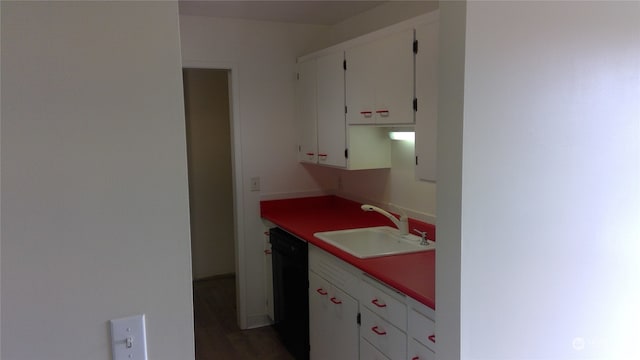 kitchen with sink, black dishwasher, and white cabinets