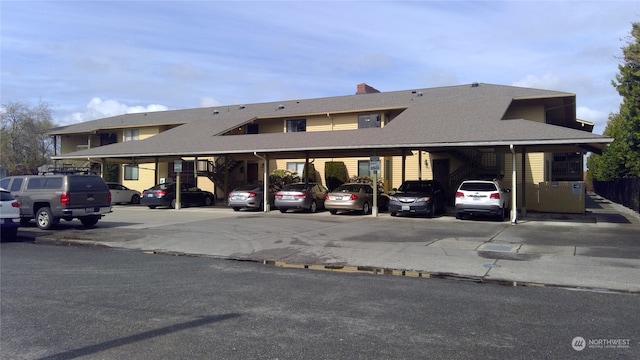 view of parking featuring a carport