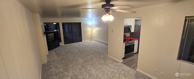 interior space with light carpet and baseboard heating