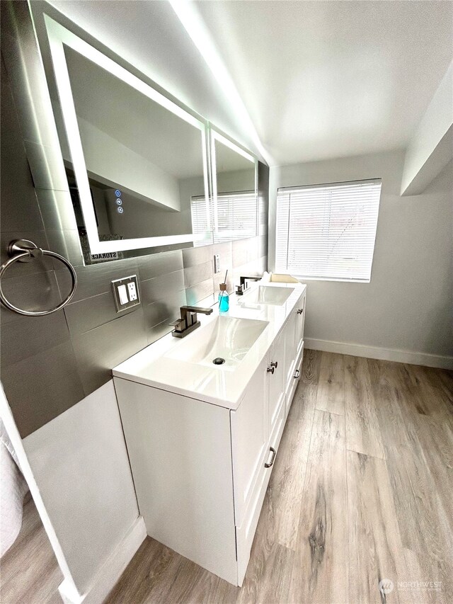 bathroom featuring hardwood / wood-style floors and vanity