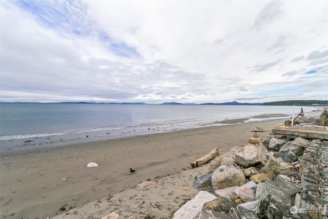 property view of water featuring a beach view