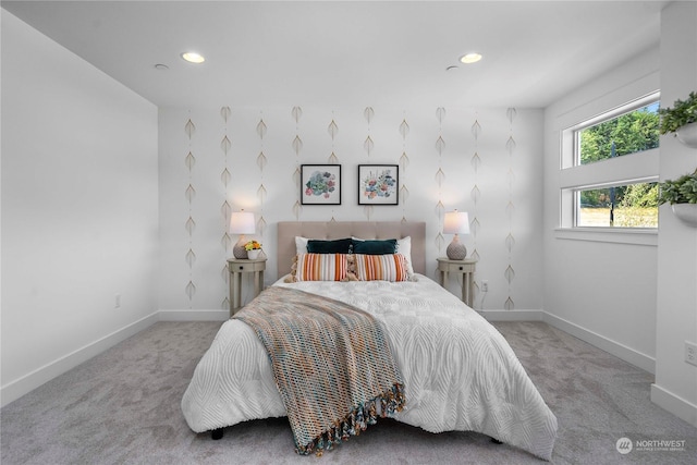 bedroom featuring light carpet