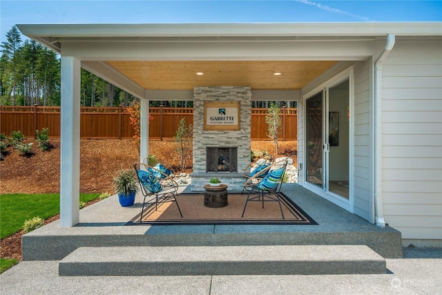 view of patio featuring an outdoor stone fireplace