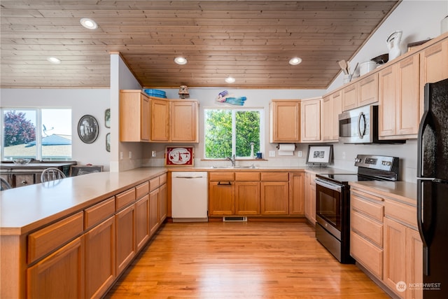 kitchen featuring appliances with stainless steel finishes, light wood-type flooring, wood ceiling, vaulted ceiling, and kitchen peninsula