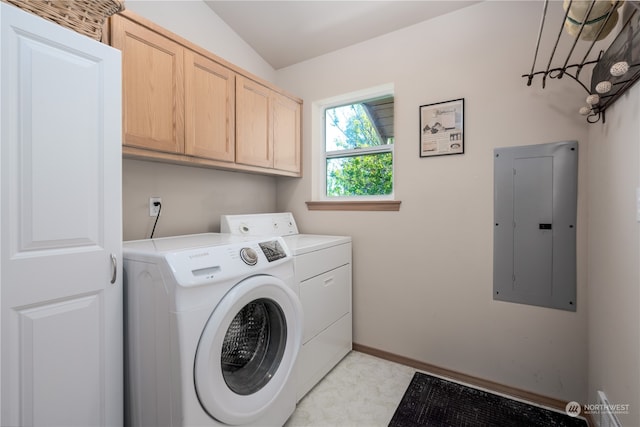 laundry area featuring cabinets and washer and clothes dryer