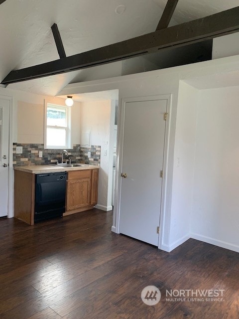 kitchen featuring backsplash, dark wood-type flooring, sink, dishwasher, and lofted ceiling with beams