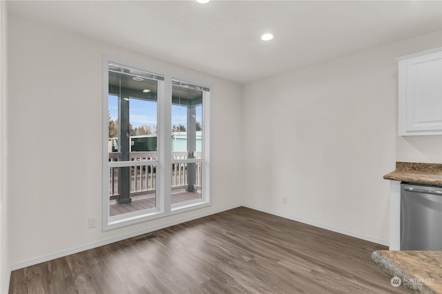 unfurnished dining area with hardwood / wood-style flooring