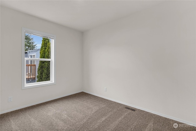 empty room with carpet flooring