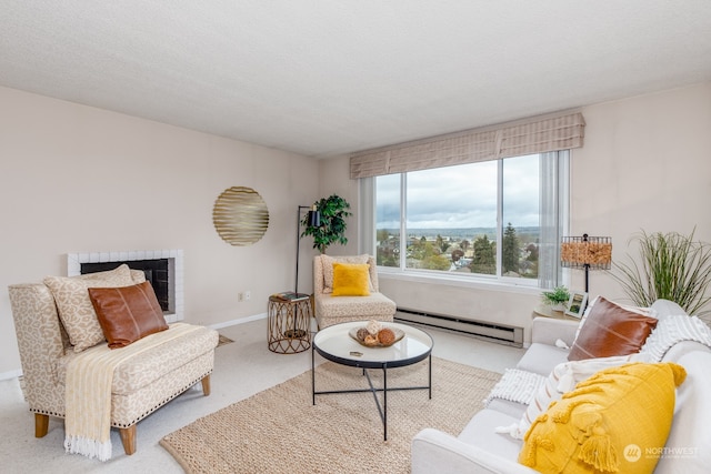 living room with a textured ceiling, a fireplace, light carpet, and a baseboard heating unit