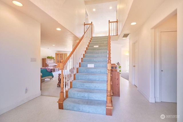 stairway with a high ceiling