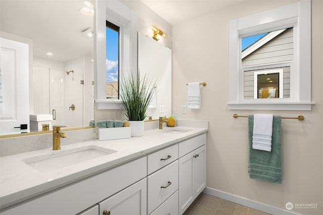 bathroom featuring vanity, tile patterned floors, and walk in shower