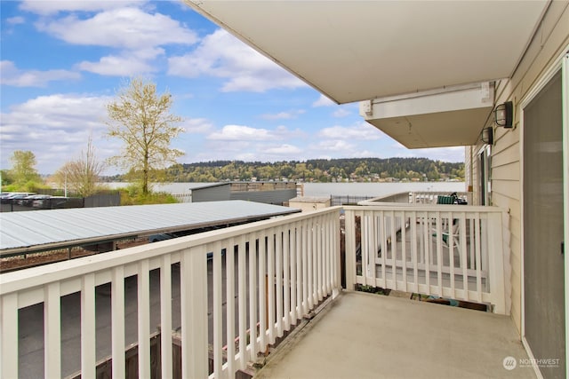 balcony featuring a water view