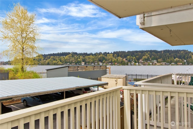 balcony featuring a water view