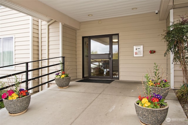 property entrance featuring a patio area