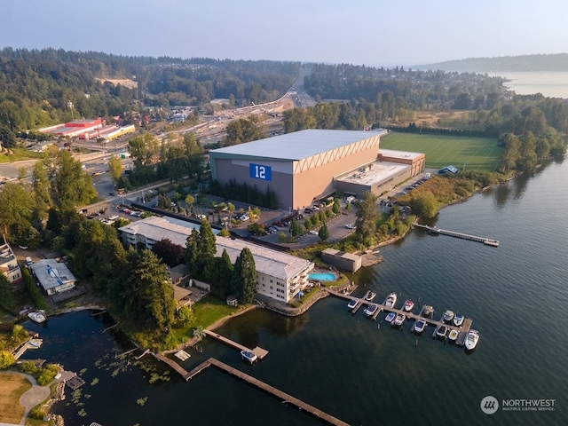 birds eye view of property with a water view