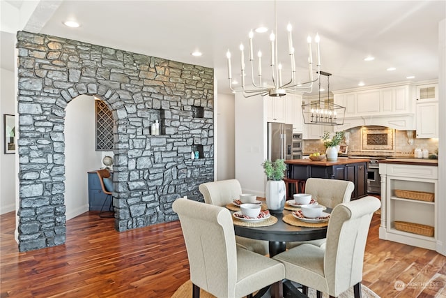 dining space with dark hardwood / wood-style floors