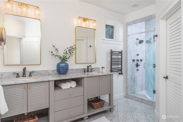 bathroom featuring tile flooring, radiator, a tile shower, and double sink vanity