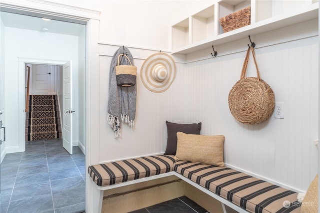 mudroom featuring dark tile flooring