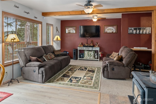 living room featuring beam ceiling, light wood-type flooring, and ceiling fan