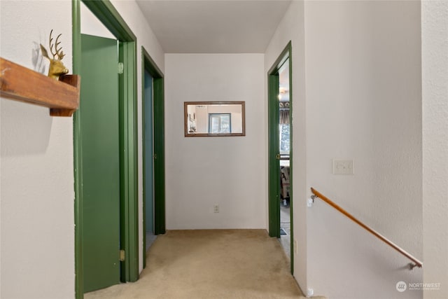 corridor with light carpet