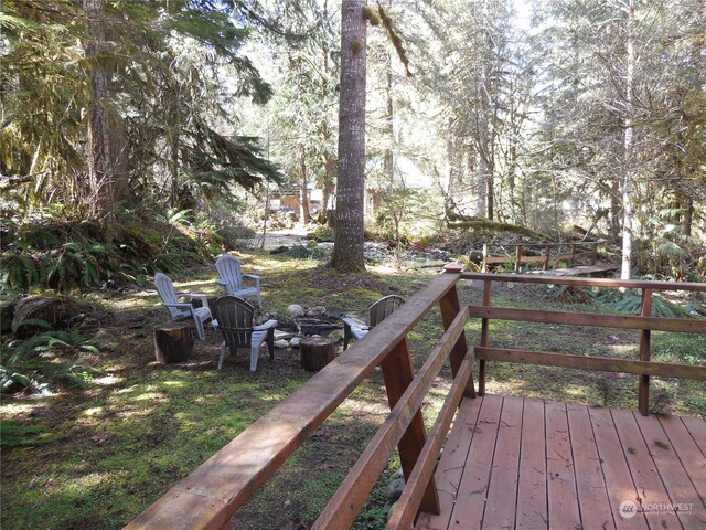 deck featuring an outdoor fire pit