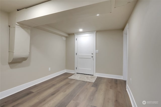 basement with wood-type flooring