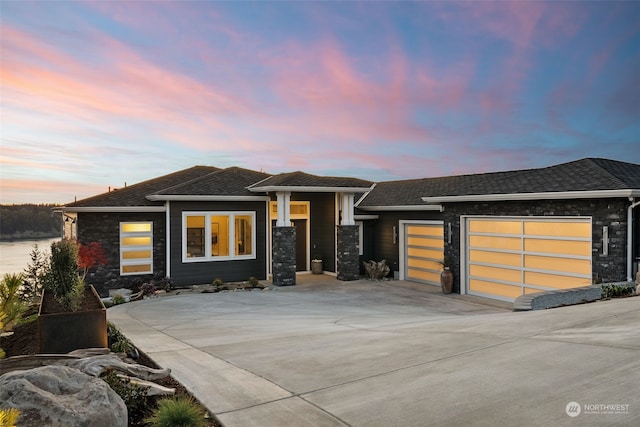 prairie-style home featuring a garage