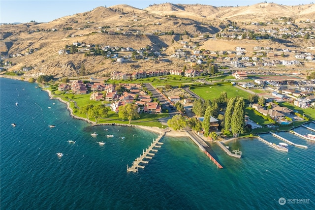 aerial view featuring a water and mountain view