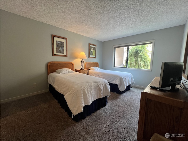 carpeted bedroom with a textured ceiling