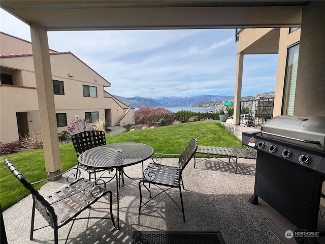 view of patio featuring a mountain view and area for grilling