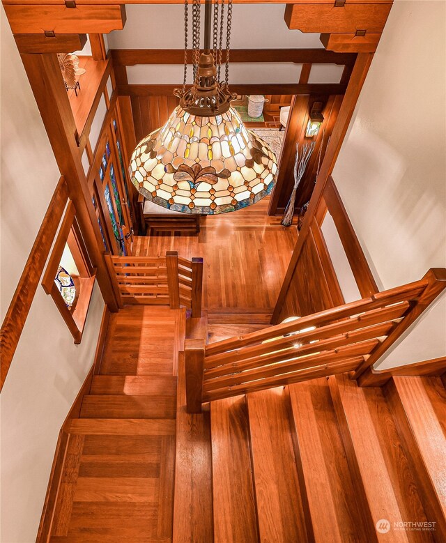 stairs featuring wood-type flooring