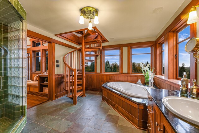 bathroom featuring tile floors, a wealth of natural light, and plus walk in shower