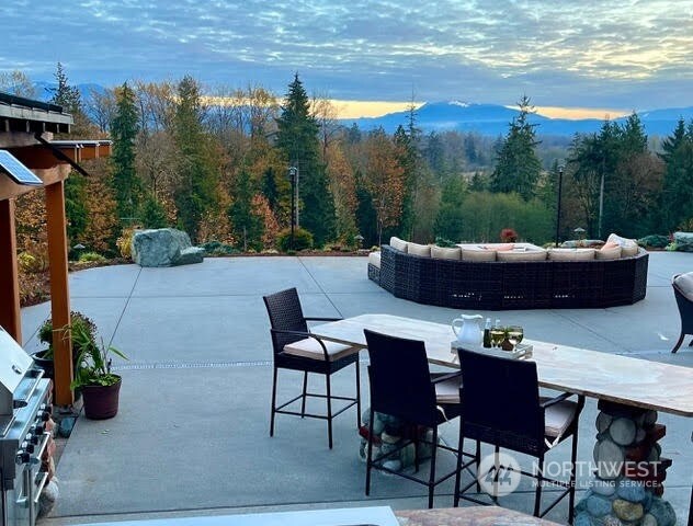 view of patio terrace at dusk