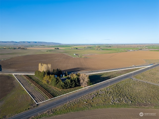 birds eye view of property with a rural view