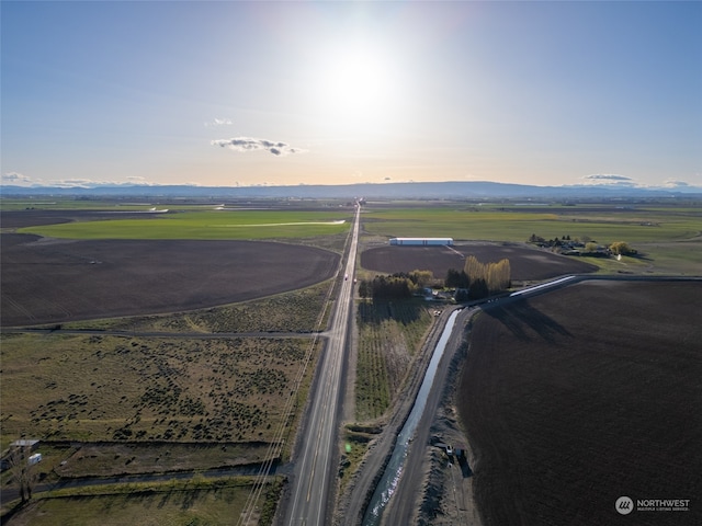 aerial view at dusk featuring a rural view