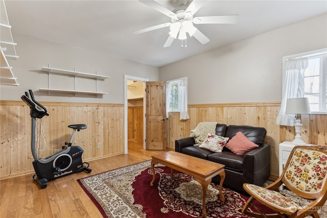 living room with ceiling fan and hardwood / wood-style flooring