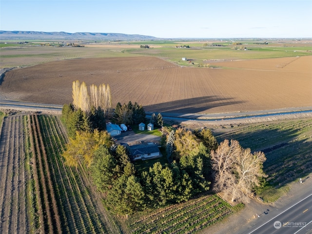 birds eye view of property with a rural view