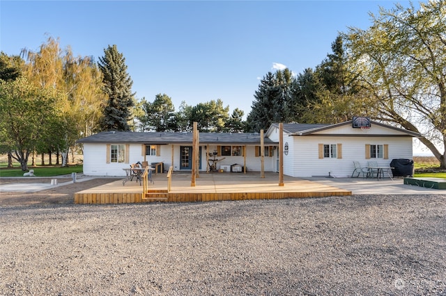 ranch-style house with a deck